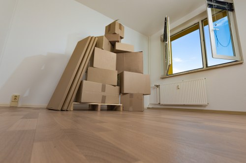 Specialist team handling a piano move through a Battersea apartment building