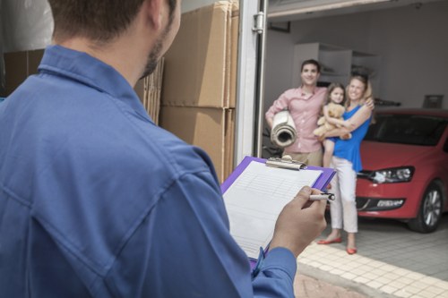 Household items being carefully moved by a Battersea van service
