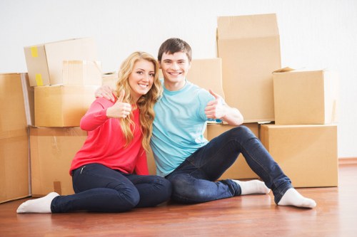 Professional moving team handling household items in Battersea
