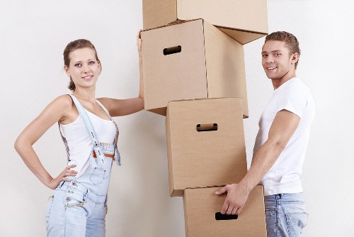 Professional movers loading items from a Battersea flat into a van